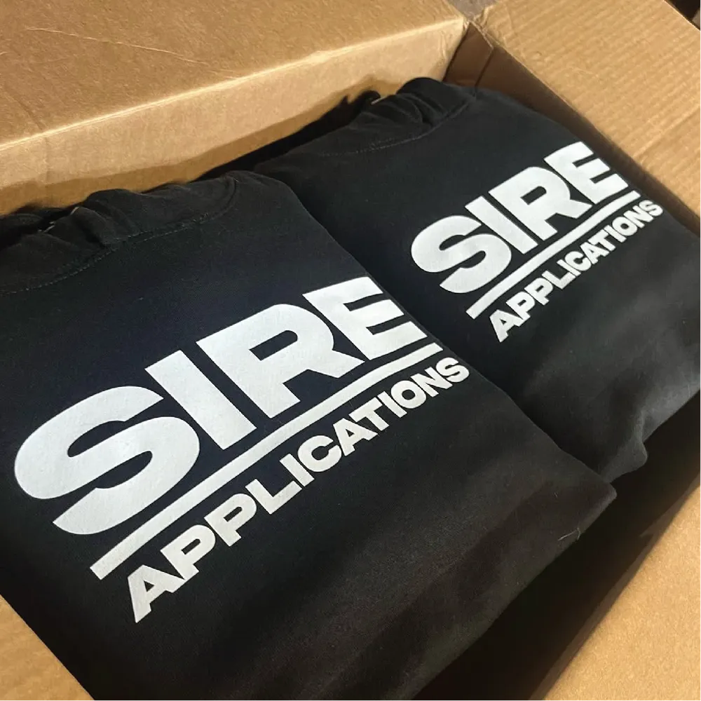 Black hoodies with white SIRE Applications company logo print