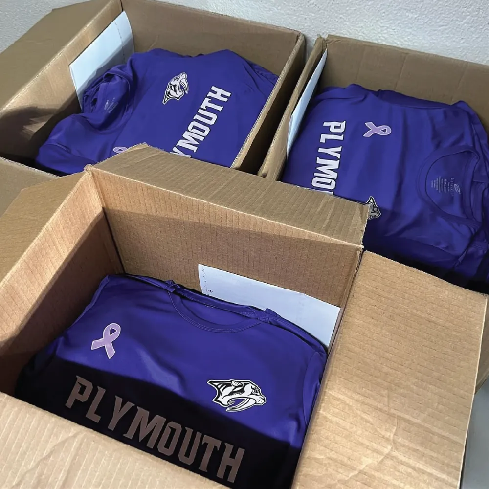 Plymouth Predators purple team shirts with screen-printed mascot and awareness ribbon